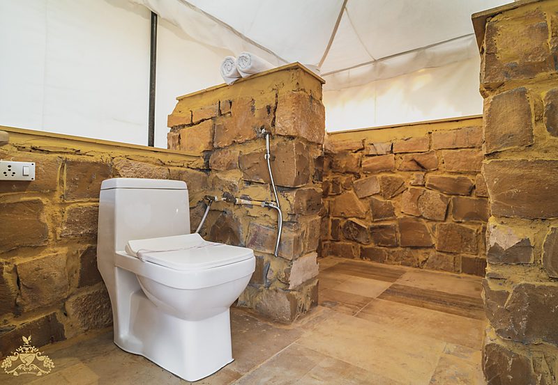 Attached bathroom inside luxury desert tent in Jaisalmer at Jadam Resort