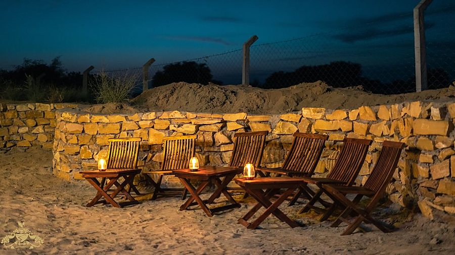 Bonfire dinner seating at restaurant of desert camp in Jaisalmer