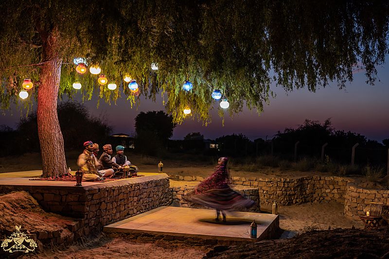 Kalbeliya folk dance under lantern tree at desert camp Jaisalmer