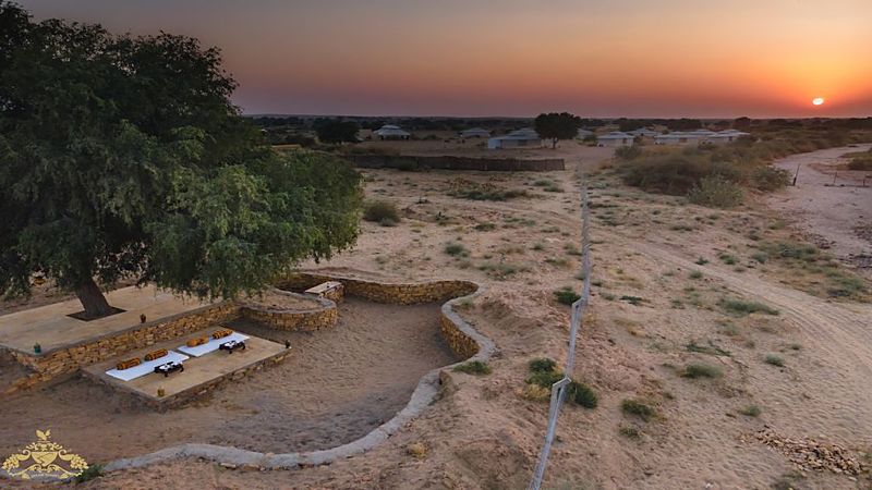 White desert tents at sunset in Jaisalmer camp