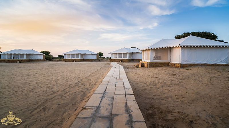 Sandstone walkway between tents at desert camp Jaisalmer